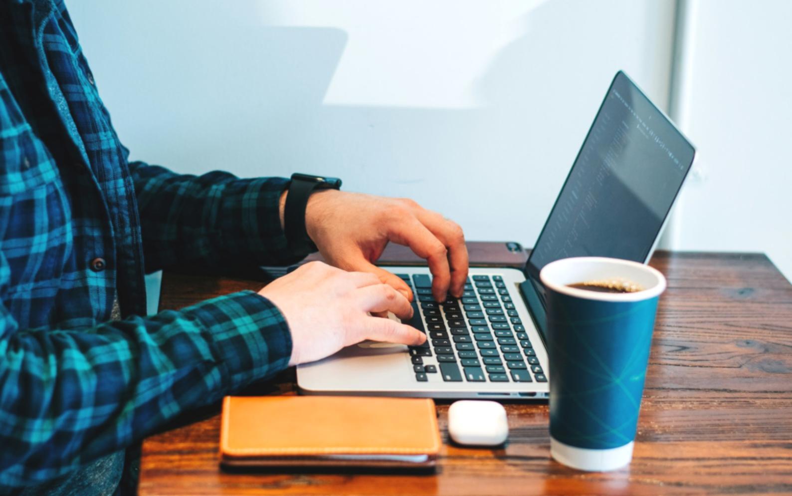 Group of finance professionals discussing charts and graphs around conference table